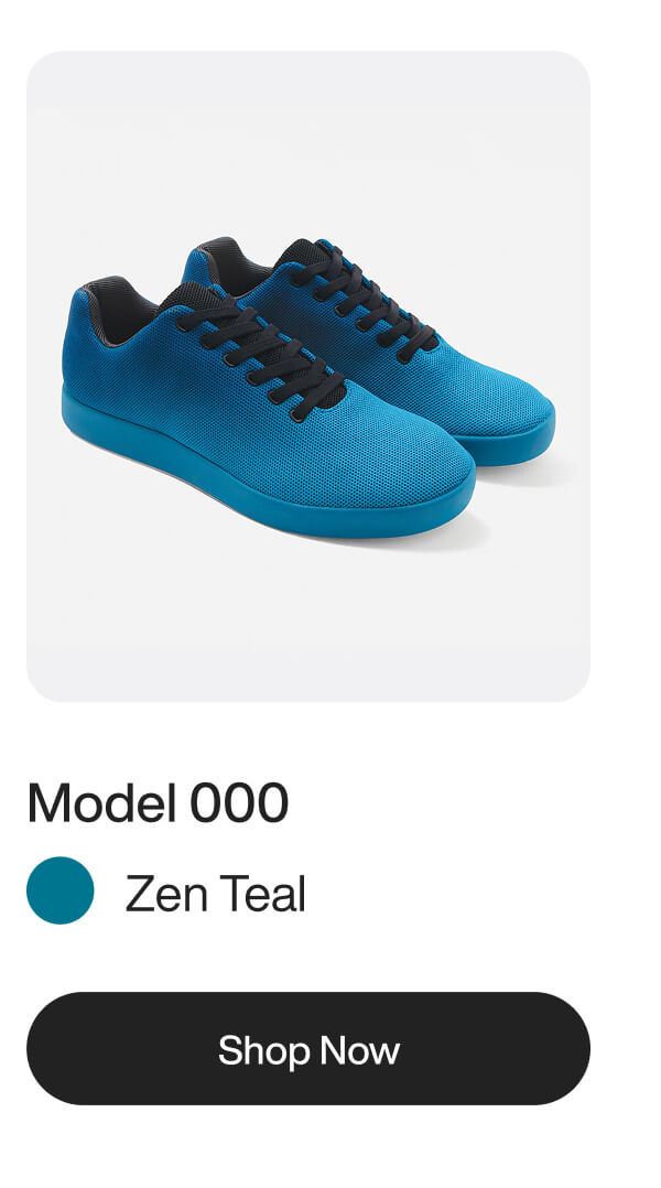 A pair of low-top sneakers in zen teal with black laces and matching teal soles.