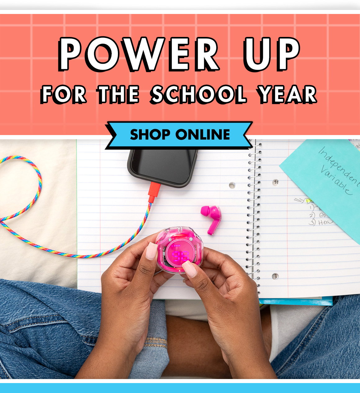 Power Up for the School Year. Image of hands holding an earbud case with a charging phone in the background.