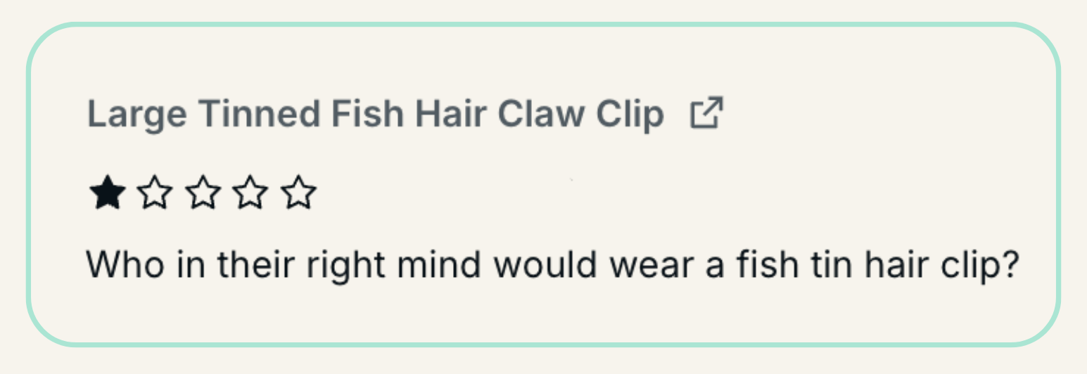 1 star review that reads, "who in their right mind would wear a fish tin hair clip?"