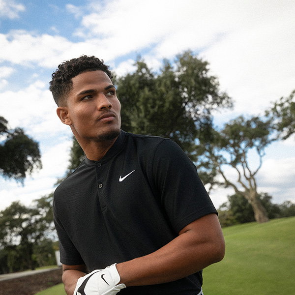 Golfer wearing Black Polo