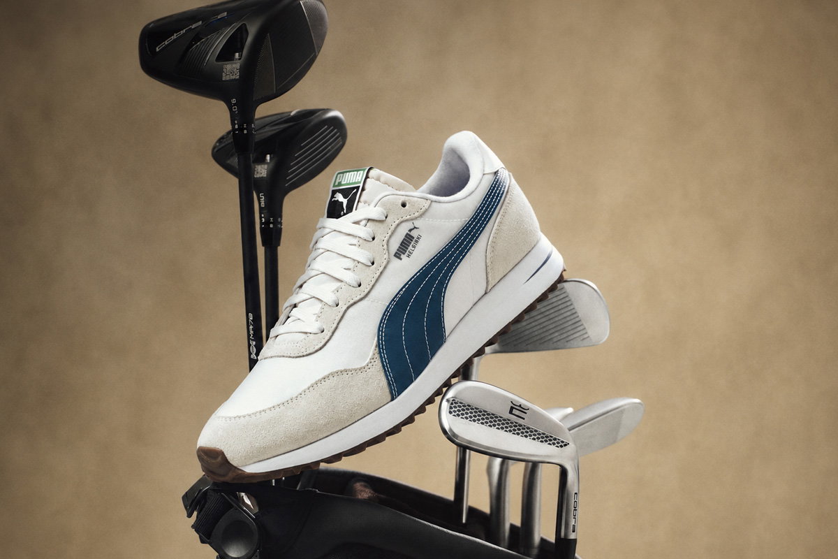 lifestyle image of golf shoe placed on golf bag