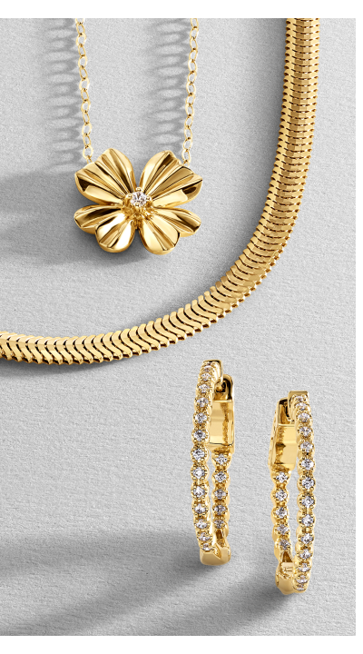 Yellow gold diamond hoop earrings, flower pendant necklace with diamond center on dainty chain and herringbone chain necklace.