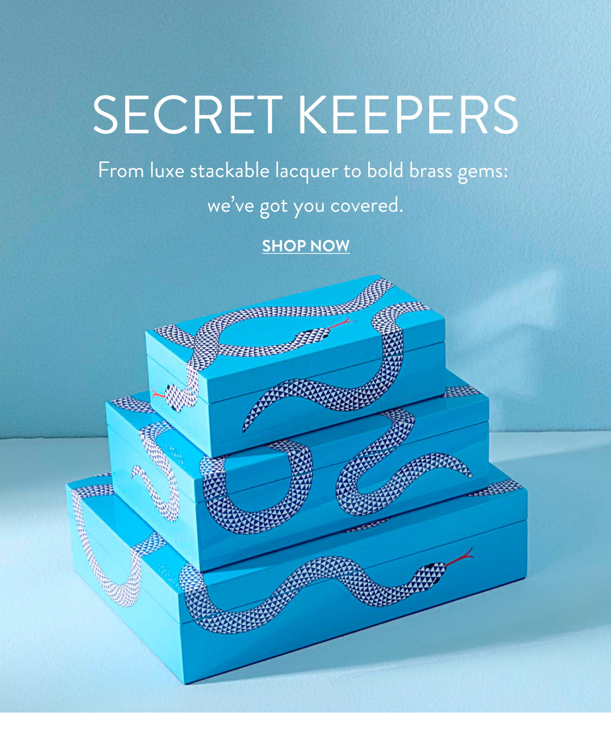 stack of blue lacquer boxes with snake pattern