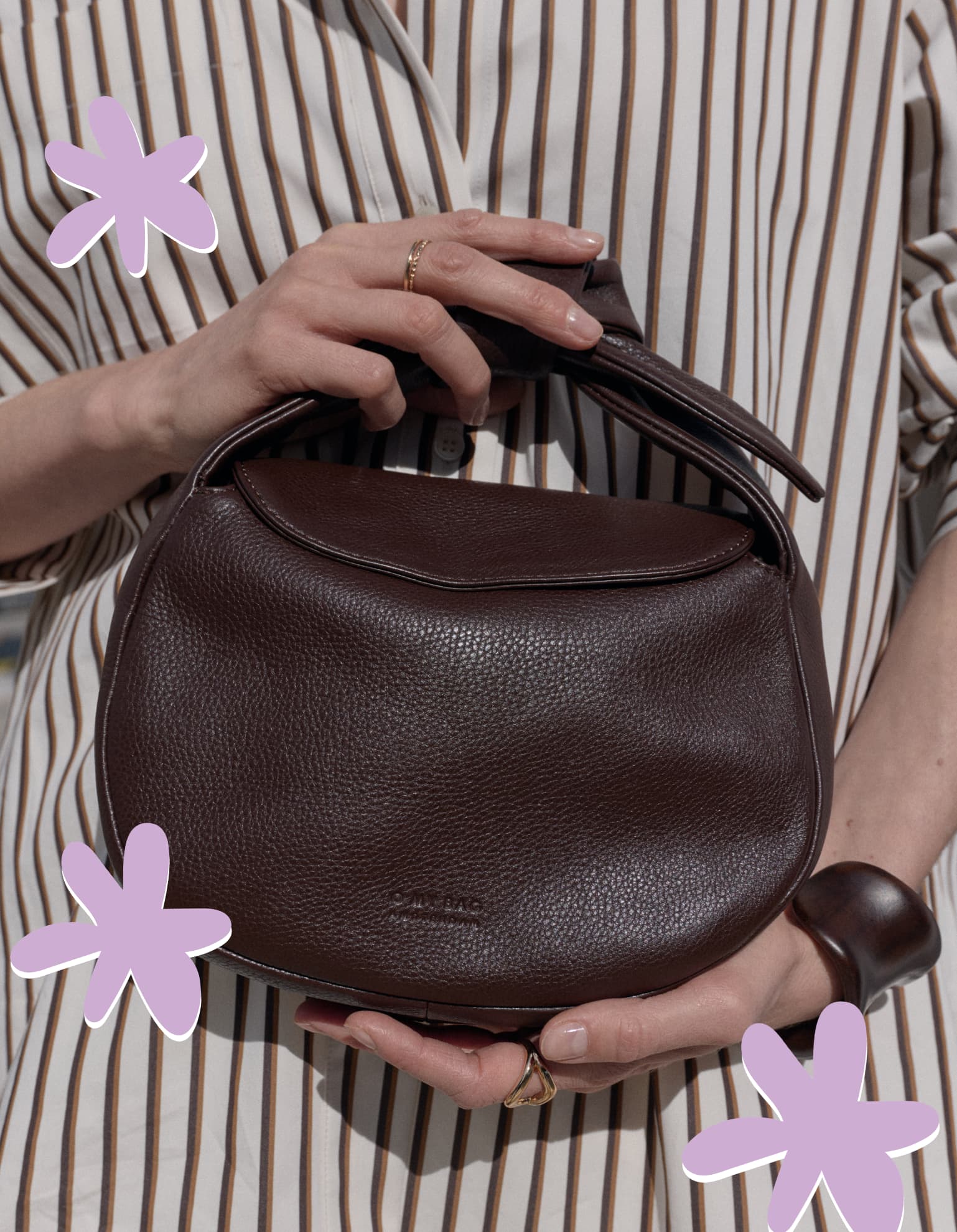 Model wearing Coco bag in color Chocolate