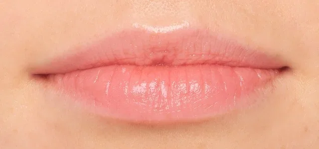 Close-up of lips wearing Extra Tinted Lip Balm.