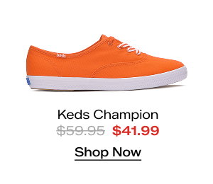 A side view of the Keds Champion Canvas Lace-Up in orange which was $59.95 and is now $41.99 for a limited time. Shop Now.