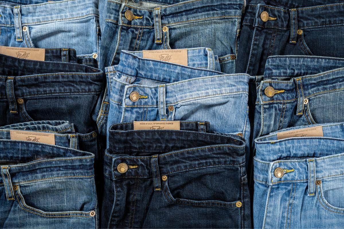 Multiply color arrays of Bills Khakis denim pants sit on dsplay