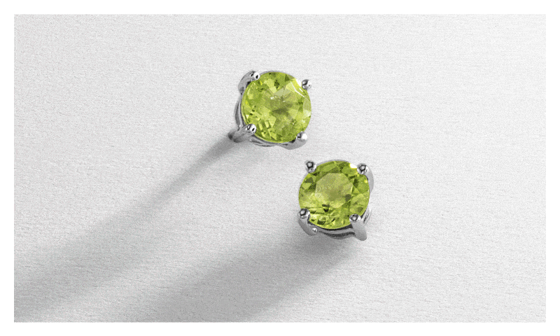 White gold green gemstone studs. White gold green gemstone tennis bracelet. White gold green peridot gemstone necklace.