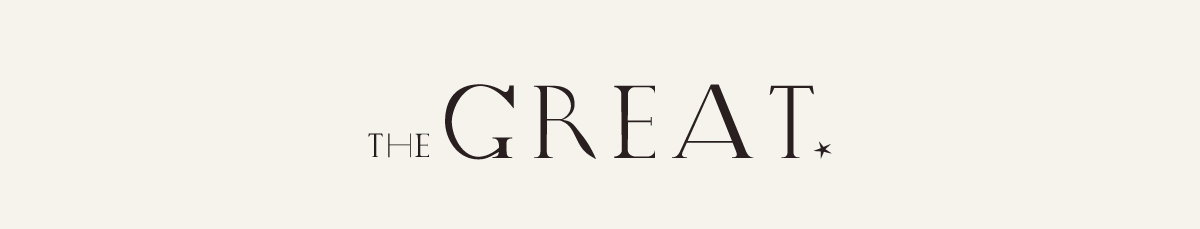 The words "THE GREAT" displayed in elegant black serif typography on an off-white background, with "THE" in smaller uppercase letters positioned to the left of the larger word "GREAT," followed by a small star symbol.