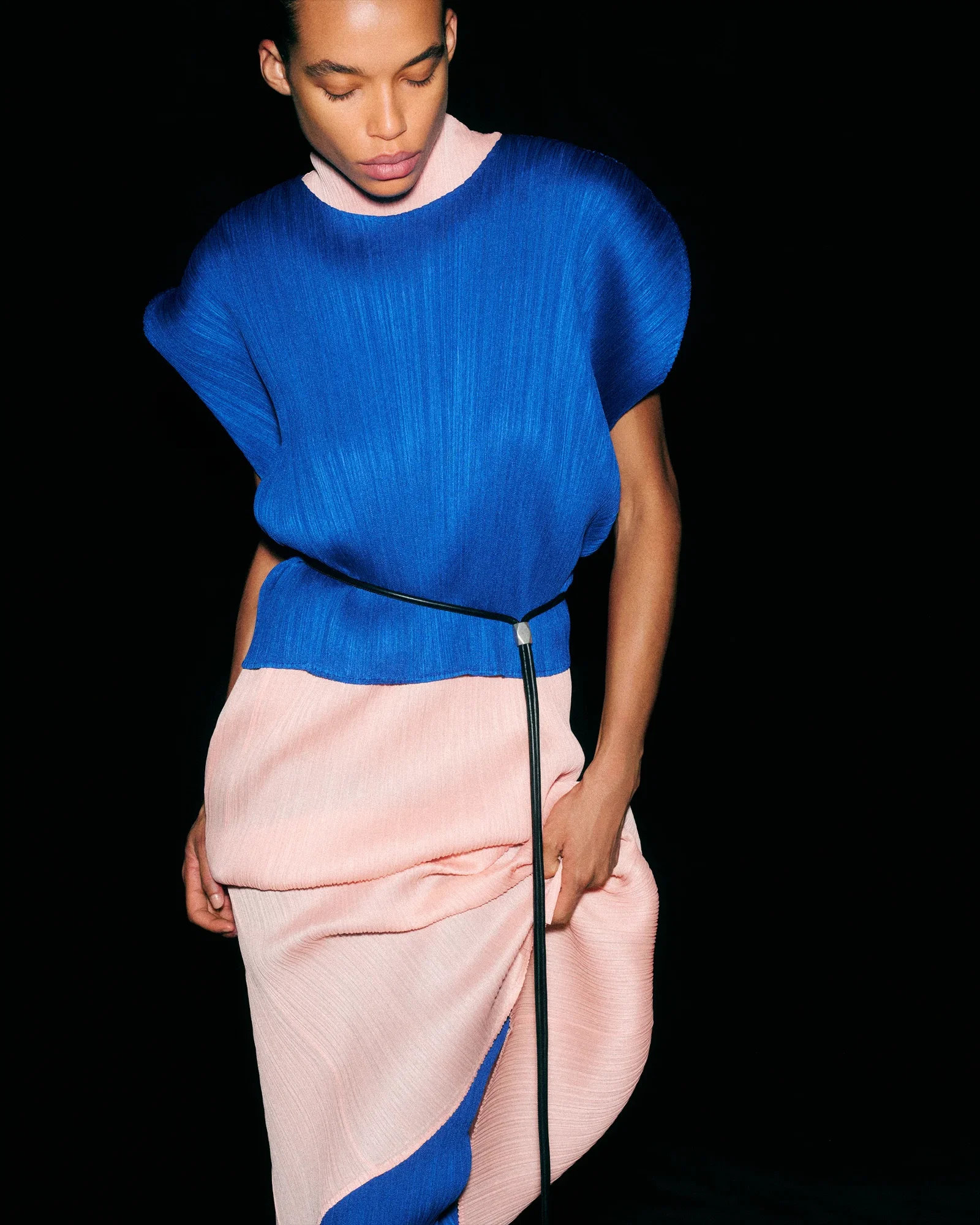 LARA wears PLEATS PLEASE