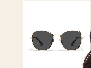 Image of large gold sunglasses with navy lenses