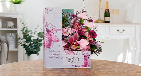 Send fresh flowers and a card before the date sneaks up.