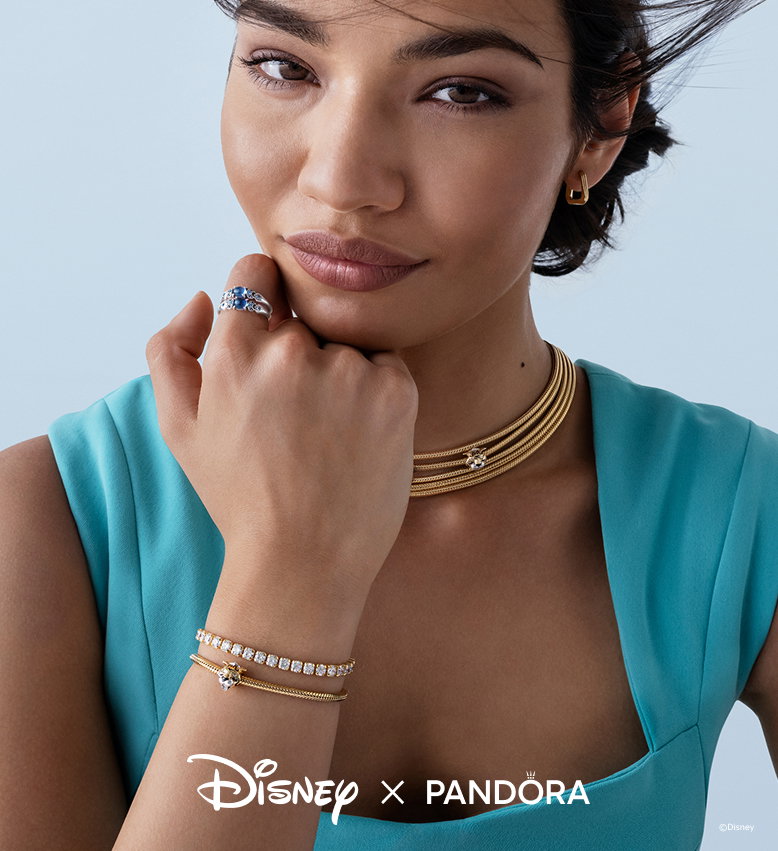 Image showing a model dressed as Princess Jasmine. She wears Jasmine rings, a necklace and bracelet with tiger charms and a sparkling tennis bracelet. 
