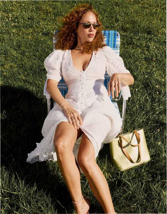 Shop dresses - woman in white puff sleeve dress
