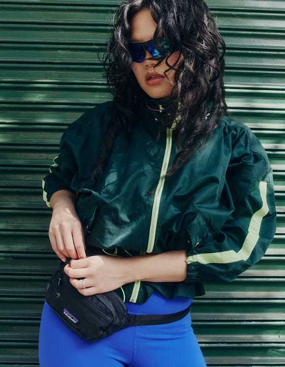 Shop activewear - woman in green windbreaker jacket