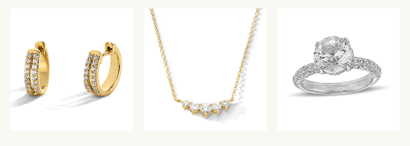 Gold hoops with diamonds, gold necklace with pendant of diamonds, & engagement ring with round-center diamond.