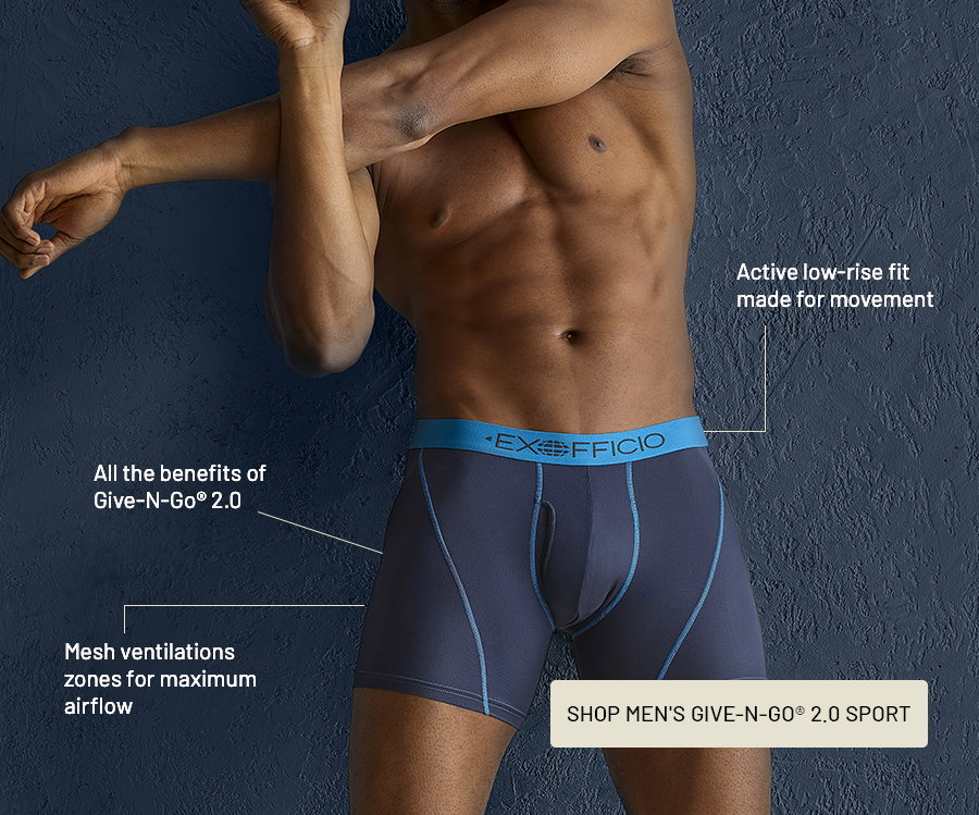Man wearing navy Give-N-Go 2.0 Sport boxer briefs with blue waistband, with callouts: all the benefits of Give-N-Go 2.0; mesh ventilation zones for maximum airflow; active low-rise fit made for movement. Button: Shop Men's Give-N-Go 2.0 Sport.