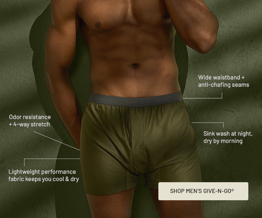 Man wearing olive Give-N-Go 2.0 boxer briefs, with callouts: odor resistance plus 4-way stretch; lightweight performance fabric keeps you cool & dry; wide waistband plus anti-chafing seams; sink wash at night, dry by morning. Button: Shop Men's Give-N-Go.