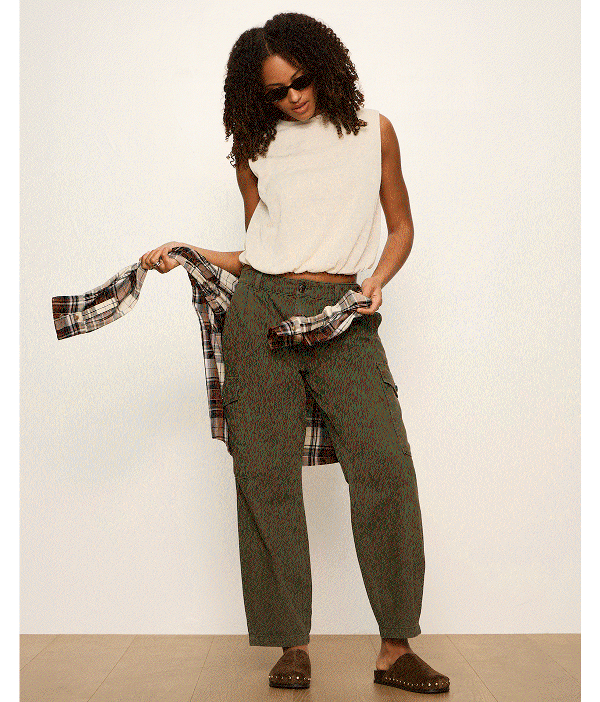 gif of model wearing updated bubble shell tank and army green pants