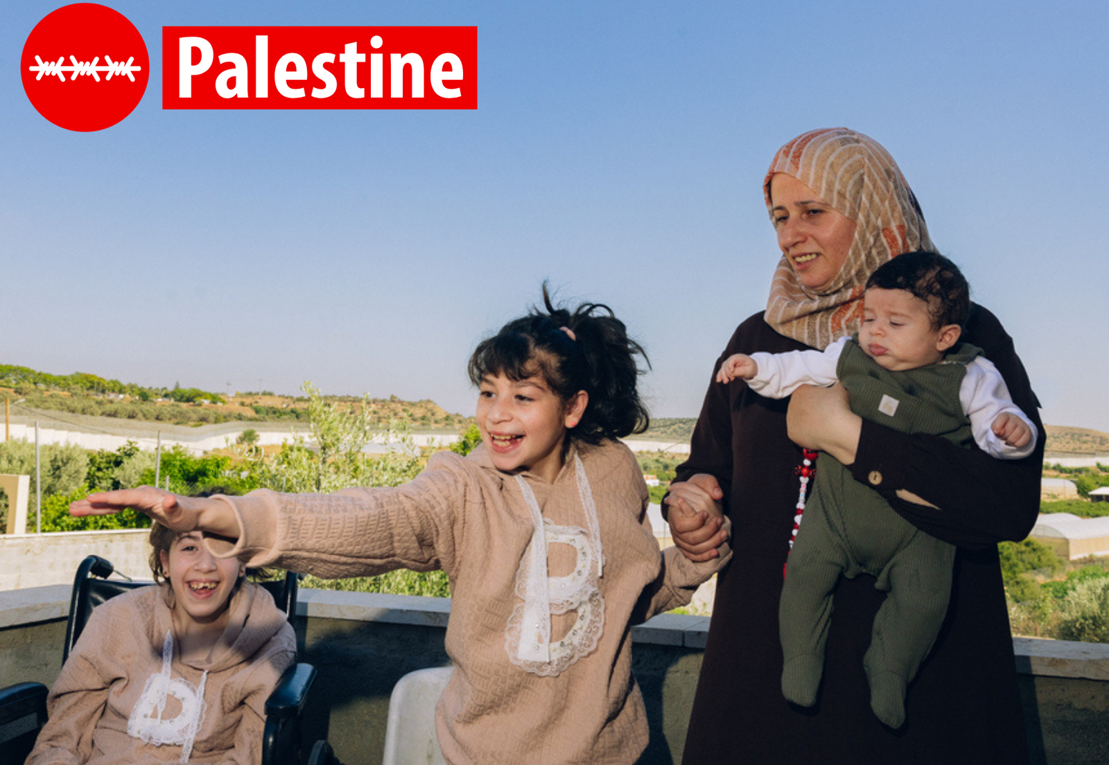 Rana with three of her children at their home in Azzun Atma, the occupied West Bank. Rana says restrictions on movement have affected nearly every aspect of family life, from education to access to healthcare. © Maen Hammad