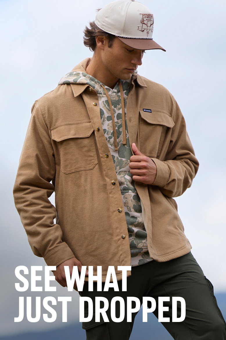 See What Just Dropped. A man wearing a camo hoodie and brown jacket. 