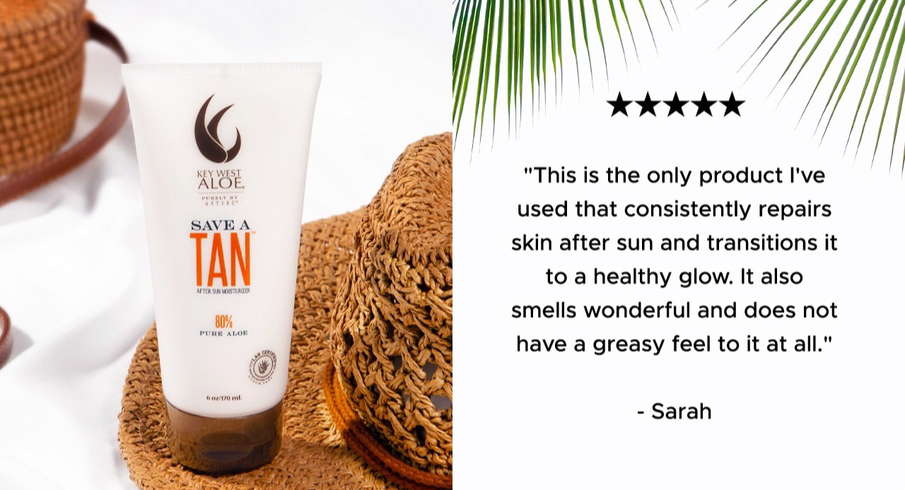 Tube of Save A Tan on the rim of a straw hat with quote.