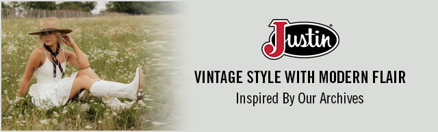 A woman sitting in the grass wearing Justin western boots. Justin Logo. Vintage Style With Modern Flair. Inspired By Our Archives