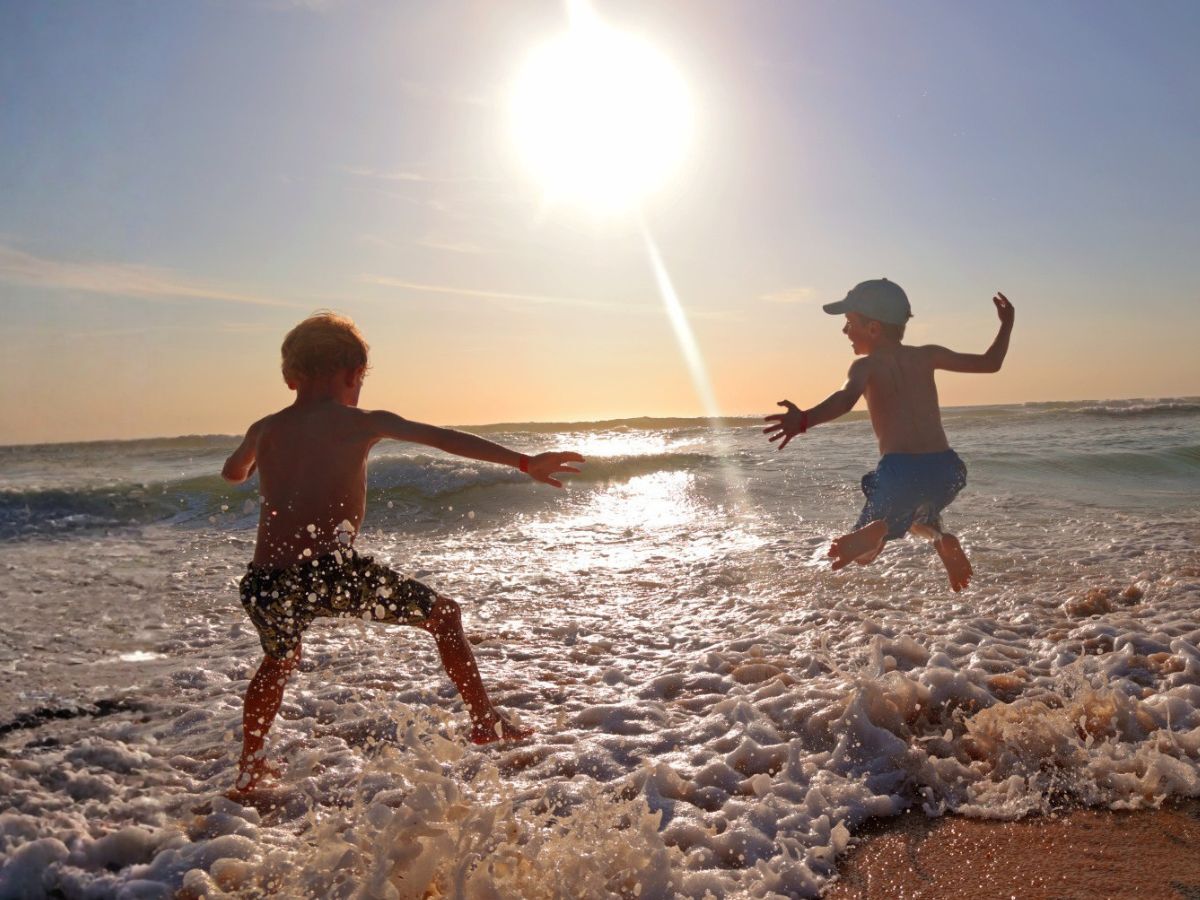 Kids jumping waves
