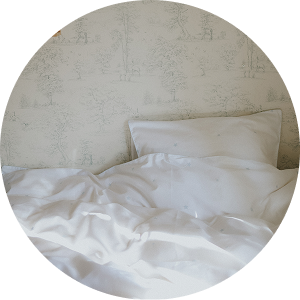 Pillow and duvet on bed against wall