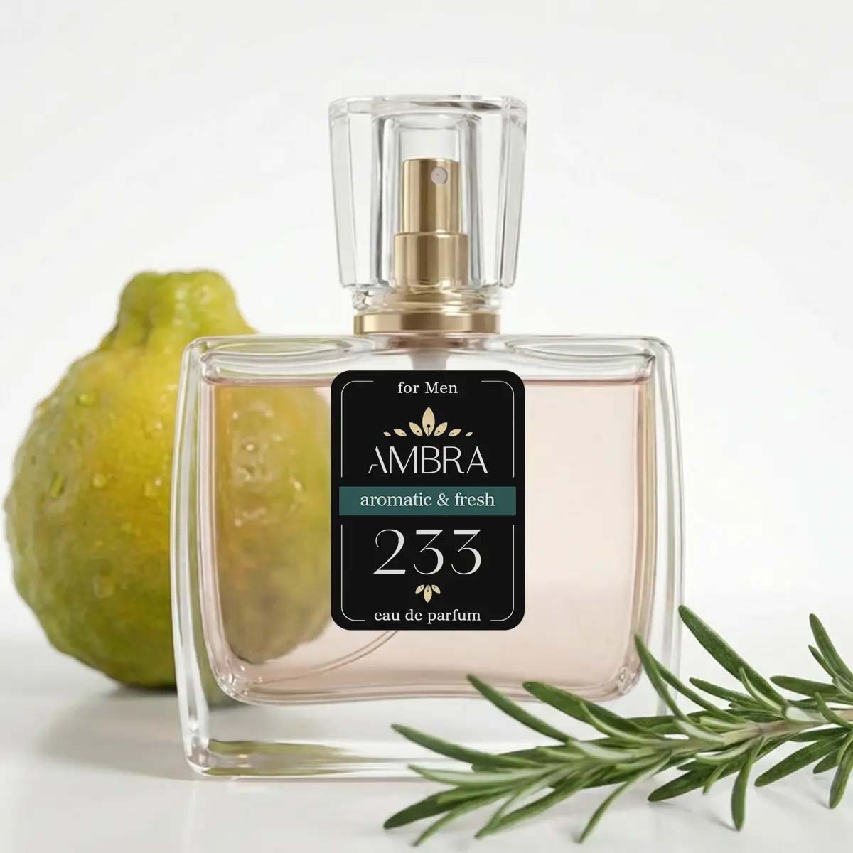Clear glass Ambra 233 eau de parfum bottle for men, aromatic & fresh, shown with a pear and rosemary sprig