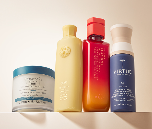 Product shot of assorted hair care products sitting on a ledge