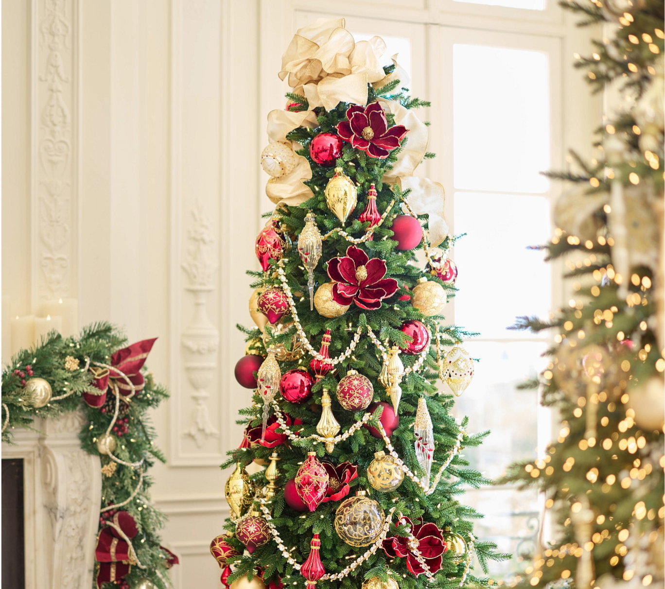 Slim Christmas tree decorated with red and gold ornaments
