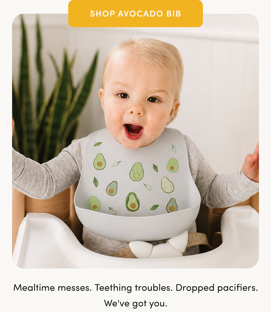 yellow button with cream text on a photo of a blonde toddler sitting in a high chair wearing a grey silicone bib with green avocados