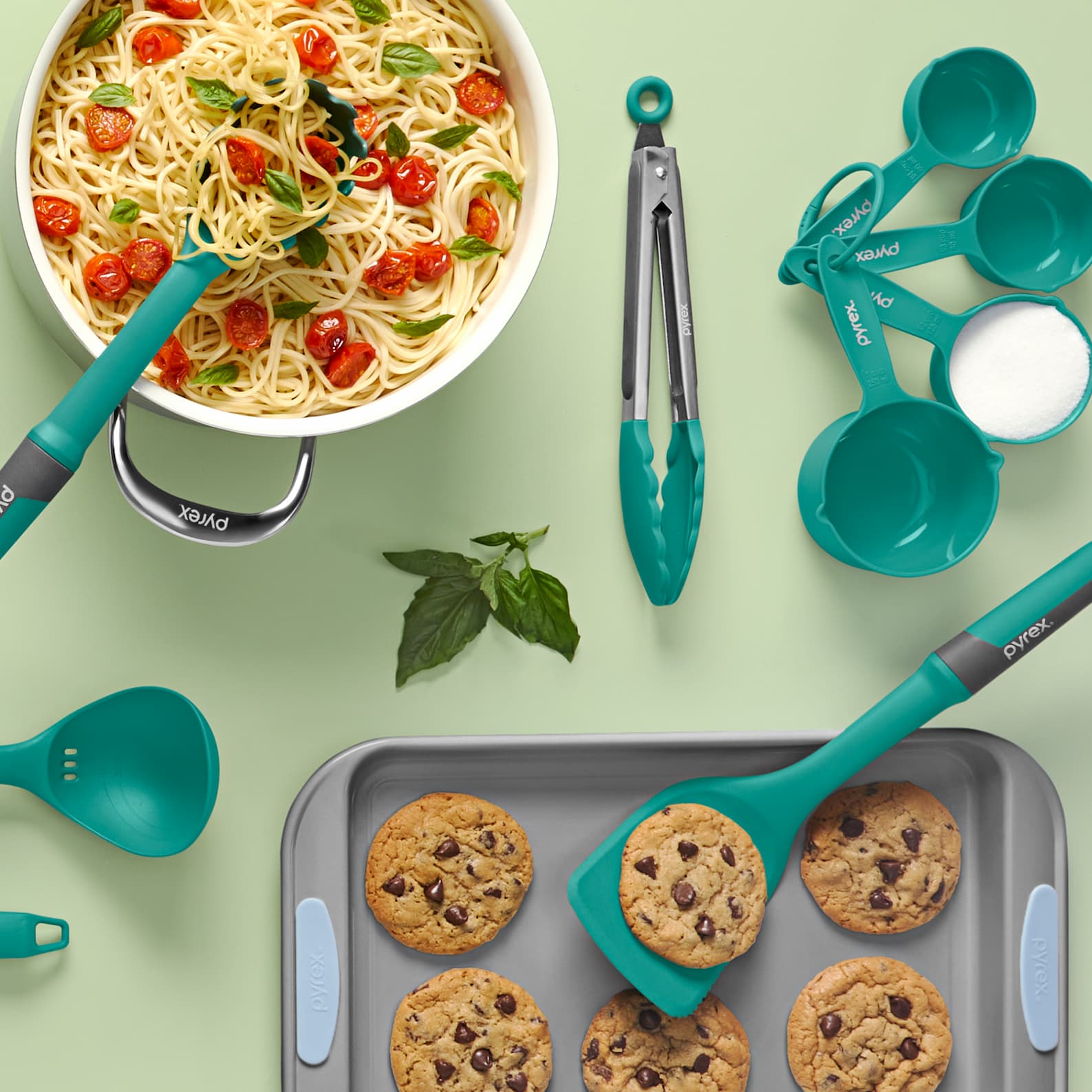 Pyrex kitchen tools and gadgets set with pasta, cookies, measuring cups and utensils.