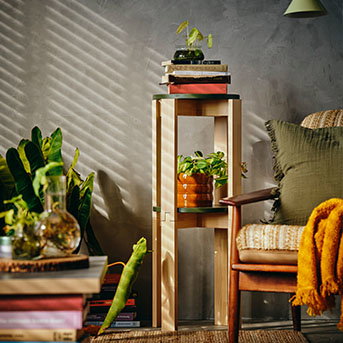 The KOMPISHÄNG stools stacked in a living room.