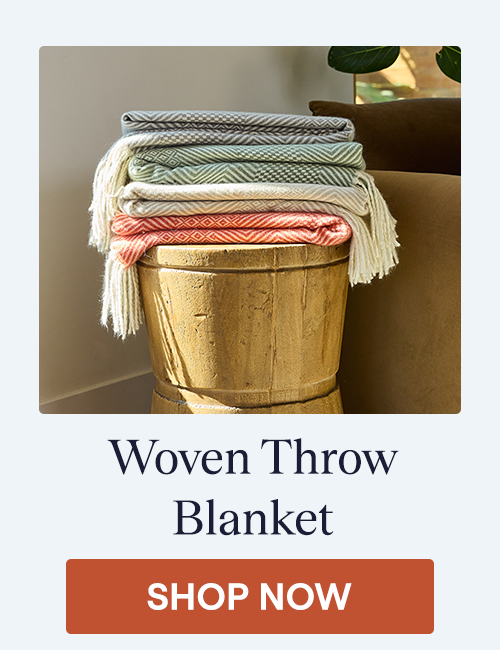 Stack of Woven Throw Blankets on a Stool