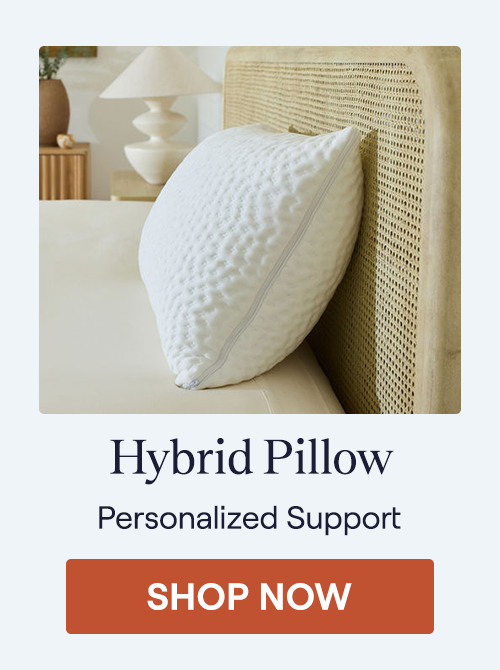 The Hybrid Pillow sitting on a bed highlighting the side zipper