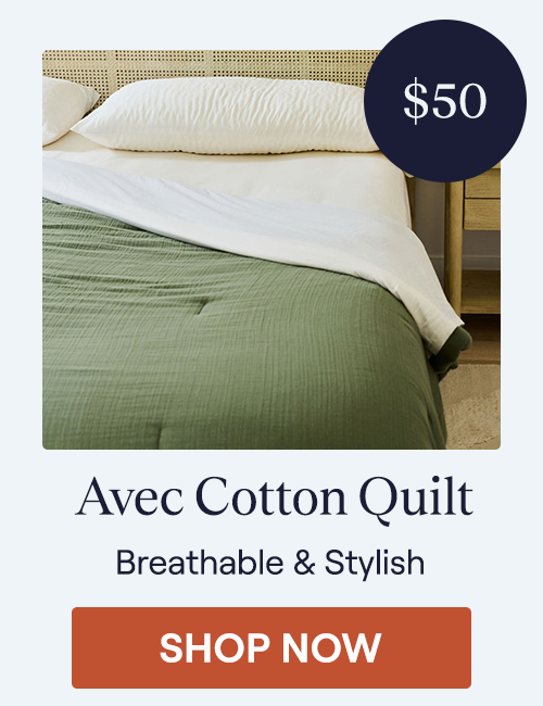 The Moss Cotton Quilt on a bed
