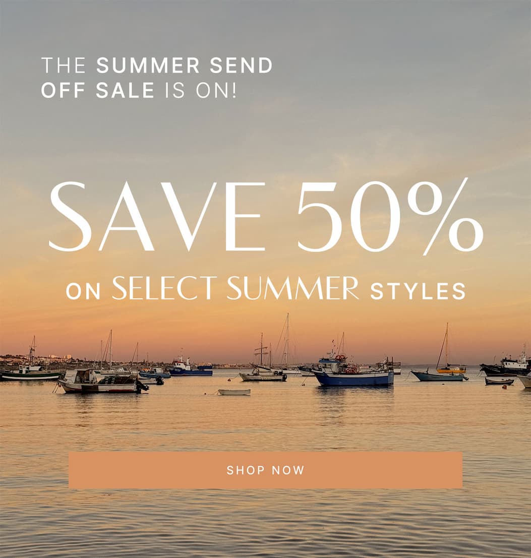 Summer Send Off Sale hero featuring boats at sunset with 50% off select summer styles and Shop Now CTA.