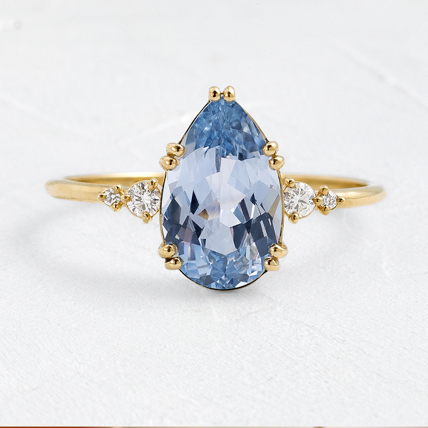 The Pictorial Ring, 1.96ct. Light Blue Sri Lanka Sapphire shown on a textured white background