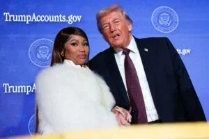 Musician Nicki Minaj joins U.S. President Donald Trump on stage as he delivers remarks during the Treasury Department's Trump Accounts Summit at Andrew W. Mellon Auditorium on January 28, 2026 in Washington, DC.