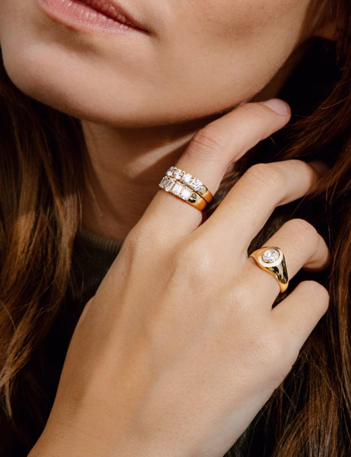 Your choice of center stone shines in an elevated east-west bezel setting and sleek solid gold band.