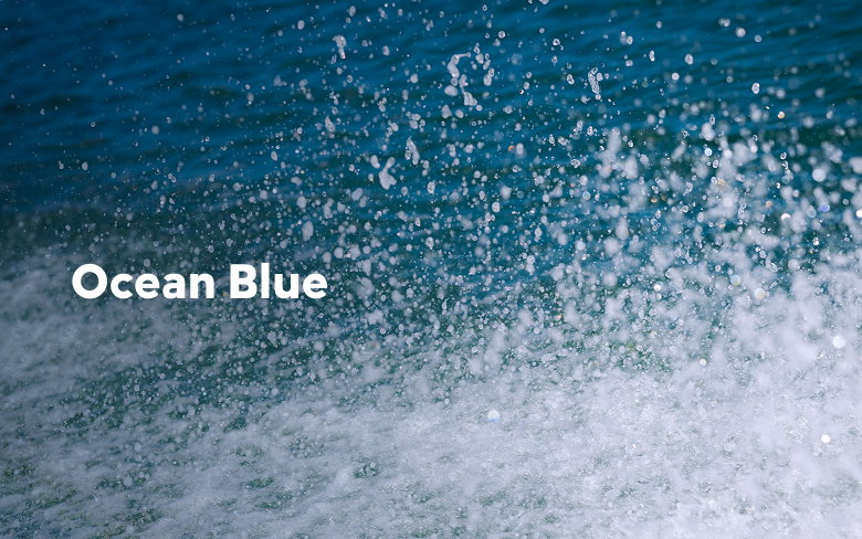 Close-up of ocean spray with text: Ocean Blue