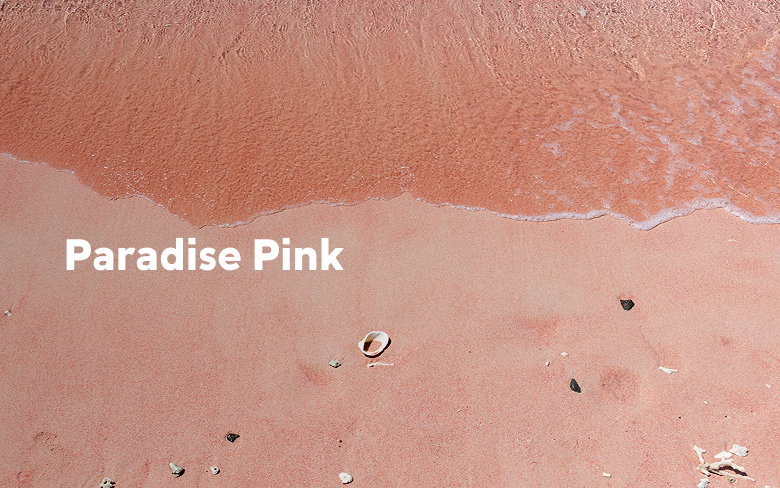 A pink sand beach with text: Paradise Pink