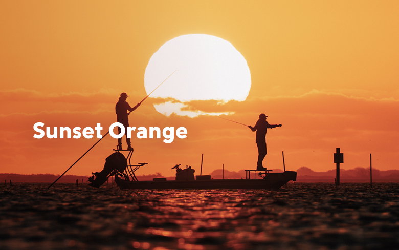 Two anglers on a skiff against an orange sunset with text: Sunset Orange