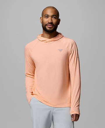 A man wearing a light orange sun hoodie.