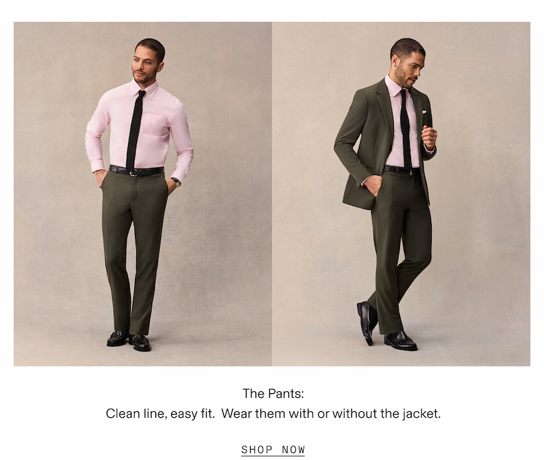 Split-layout image of the same model in two poses against a tan backdrop: on the left he wears a pink button-down shirt, black tie, and olive dress pants with his hands in his pockets; on the right he wears the full olive suit with the same pink shirt and tie, jacket open, one hand raised near his chest. Text below reads: The Pants: Clean line, easy fit. Wear them with or without the jacket. SHOP NOW.