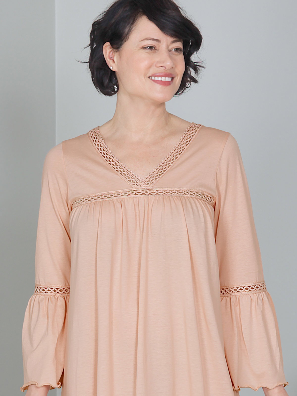 Piper Nightgown An elegant Peach ladies nightgown crafted from exceptionally soft pima cotton. Beautiful, tailored lace and delicate lettuce-hem detailing along sleeves and hem  adds timeless femininity. Made in Peru.