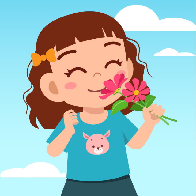 Little girl smelling flowers.