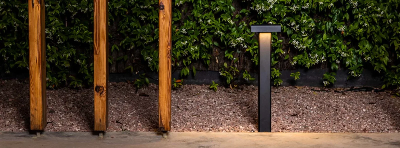 Faro — outdoor bollard in a summer garden at sunset
